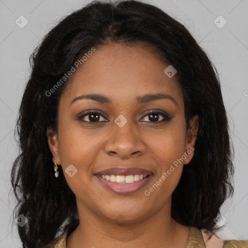 Joyful black young-adult female with long  brown hair and brown eyes