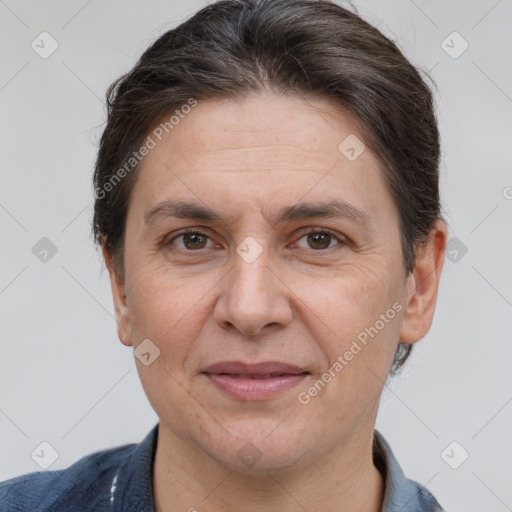 Joyful white adult female with short  brown hair and brown eyes