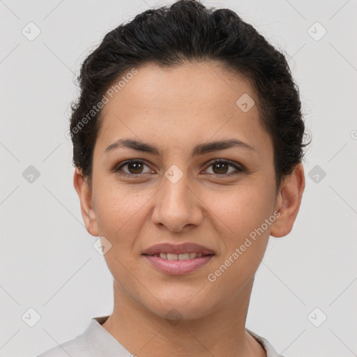 Joyful latino young-adult female with short  brown hair and brown eyes