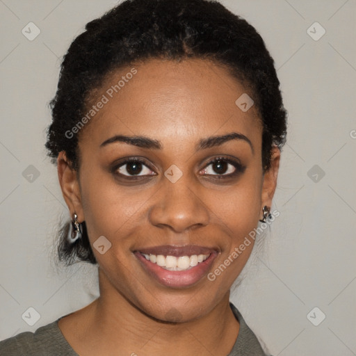 Joyful black young-adult female with short  black hair and brown eyes