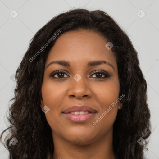 Joyful black young-adult female with long  brown hair and brown eyes