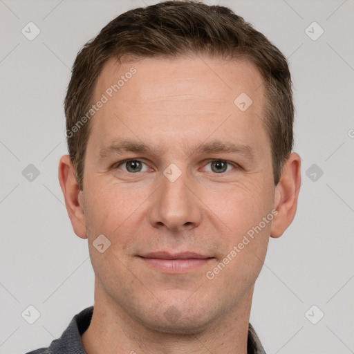 Joyful white adult male with short  brown hair and grey eyes