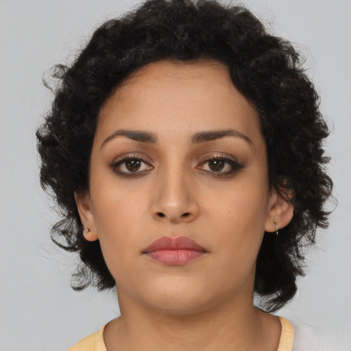Neutral latino young-adult female with long  black hair and brown eyes