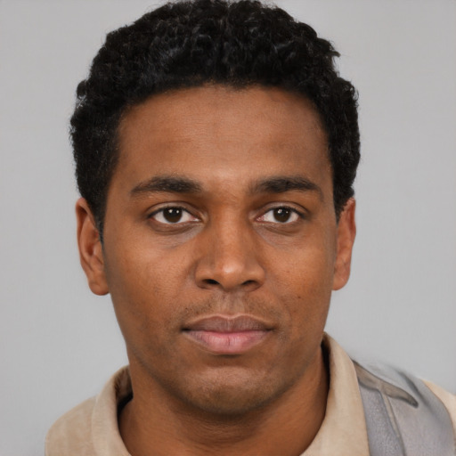 Neutral black young-adult male with short  black hair and brown eyes