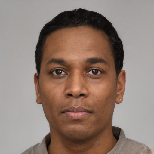 Neutral black young-adult male with short  black hair and brown eyes