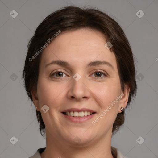 Joyful white adult female with medium  brown hair and brown eyes