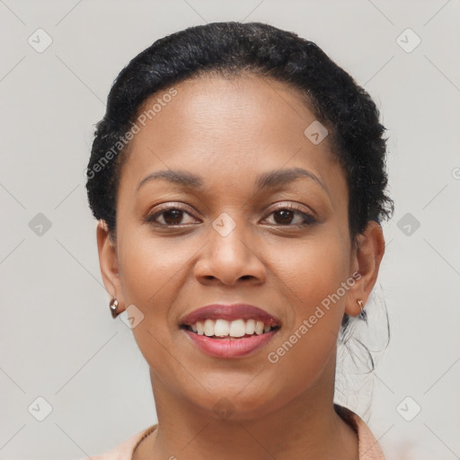 Joyful black young-adult female with short  brown hair and brown eyes