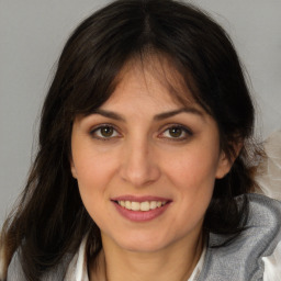 Joyful white young-adult female with medium  brown hair and brown eyes