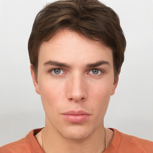 Neutral white young-adult male with short  brown hair and grey eyes