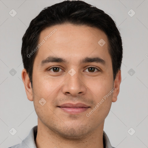 Joyful white young-adult male with short  black hair and brown eyes