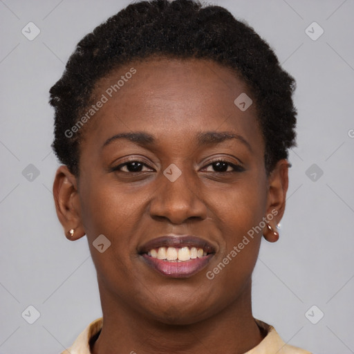 Joyful black young-adult female with short  brown hair and brown eyes