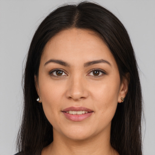 Joyful white young-adult female with long  brown hair and brown eyes