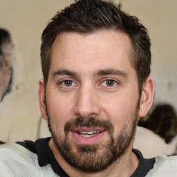 Joyful white young-adult male with short  brown hair and brown eyes