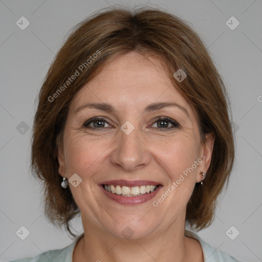 Joyful white adult female with medium  brown hair and brown eyes