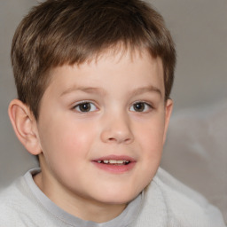 Joyful white child male with short  brown hair and brown eyes