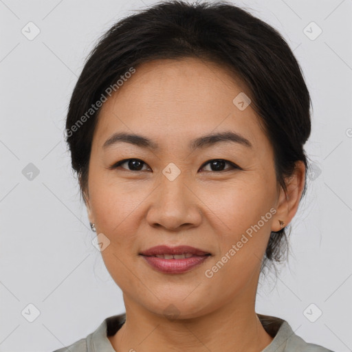 Joyful asian young-adult female with short  brown hair and brown eyes