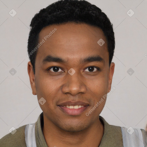 Joyful black young-adult male with short  black hair and brown eyes