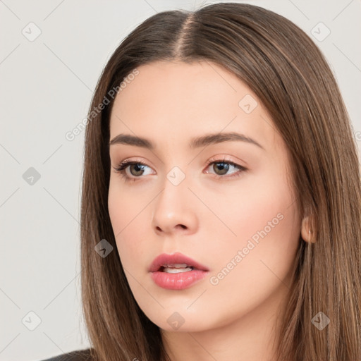 Neutral white young-adult female with long  brown hair and brown eyes