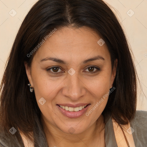 Joyful white adult female with long  brown hair and brown eyes