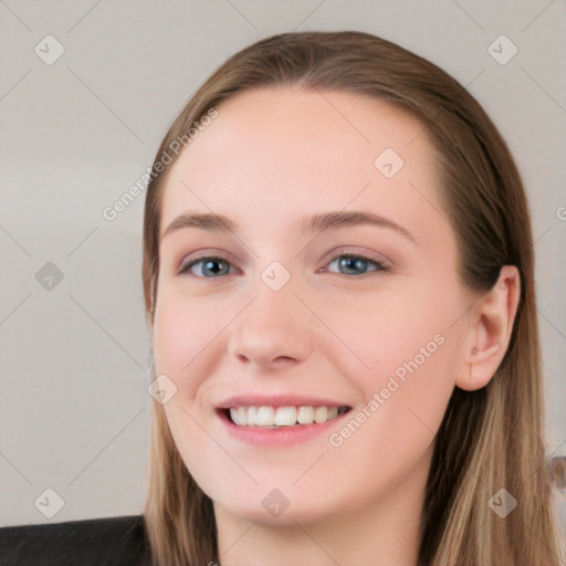 Joyful white young-adult female with long  brown hair and blue eyes