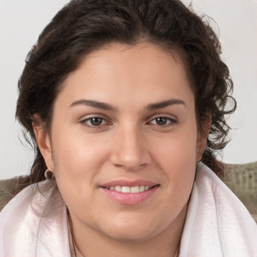 Joyful white young-adult female with medium  brown hair and brown eyes