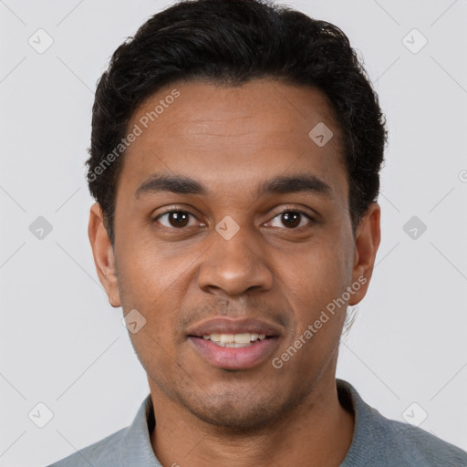 Joyful black young-adult male with short  brown hair and brown eyes