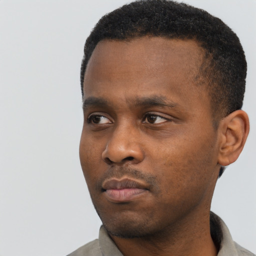 Neutral black young-adult male with short  black hair and brown eyes