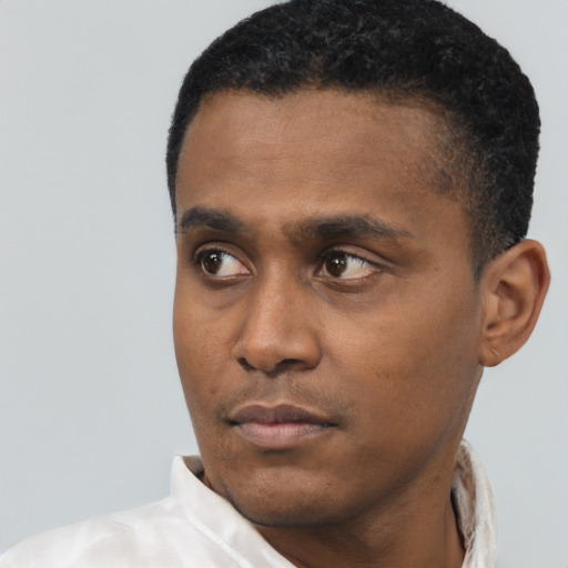 Neutral black young-adult male with short  black hair and brown eyes