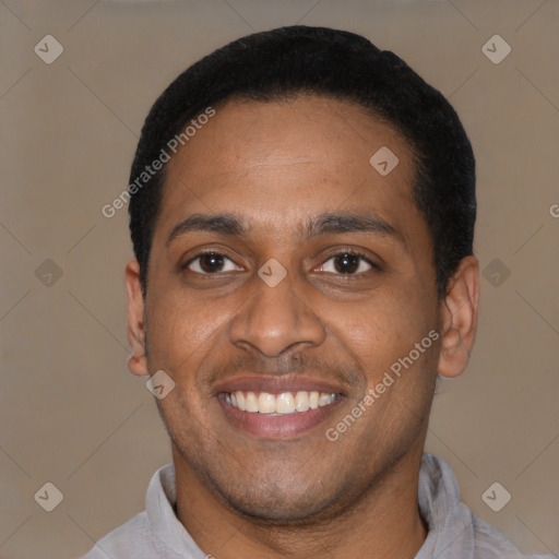 Joyful latino young-adult male with short  black hair and brown eyes