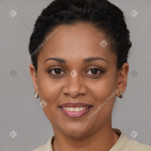 Joyful black young-adult female with short  brown hair and brown eyes