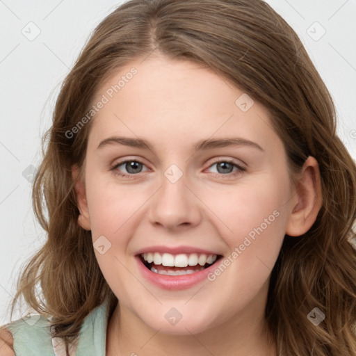 Joyful white young-adult female with long  brown hair and blue eyes