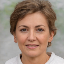 Joyful white adult female with short  brown hair and brown eyes