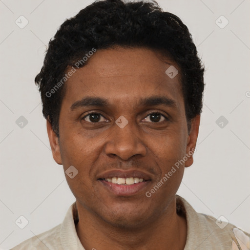 Joyful black young-adult male with short  black hair and brown eyes