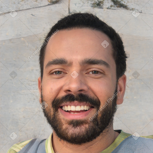 Joyful white young-adult male with short  black hair and brown eyes