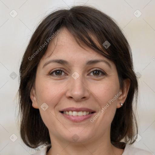 Joyful white adult female with medium  brown hair and brown eyes