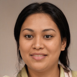 Joyful latino young-adult female with medium  brown hair and brown eyes