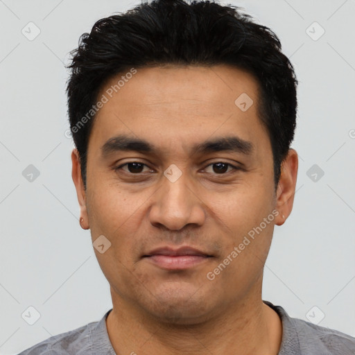 Joyful asian young-adult male with short  black hair and brown eyes
