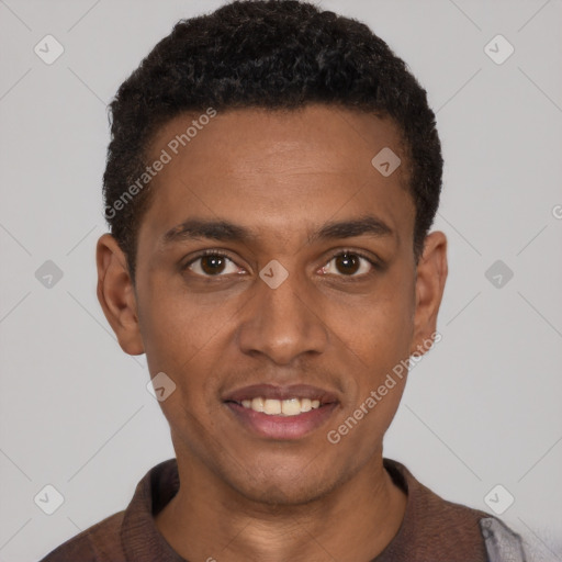 Joyful black young-adult male with short  black hair and brown eyes