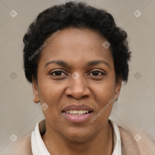 Joyful black adult female with short  brown hair and brown eyes