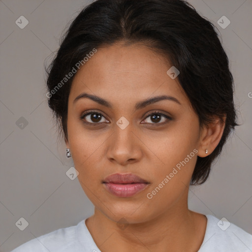 Joyful latino young-adult female with medium  brown hair and brown eyes