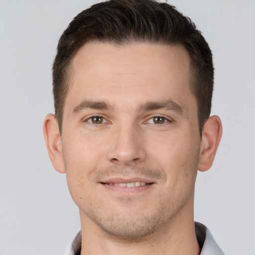 Joyful white young-adult male with short  brown hair and brown eyes