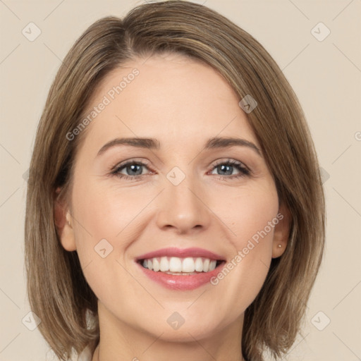 Joyful white young-adult female with medium  brown hair and green eyes