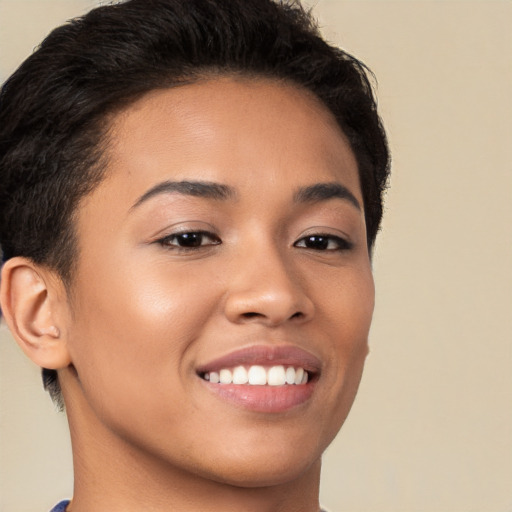 Joyful latino young-adult female with short  brown hair and brown eyes