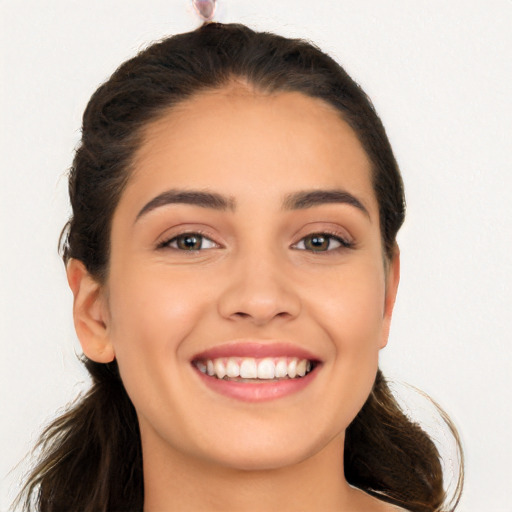 Joyful white young-adult female with long  brown hair and brown eyes