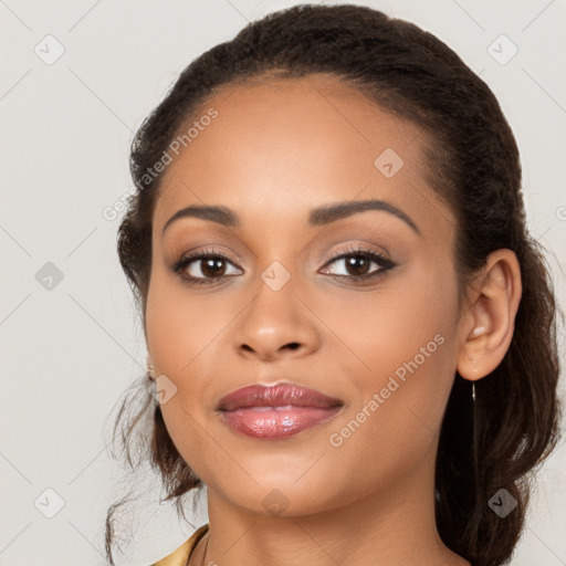 Joyful latino young-adult female with long  brown hair and brown eyes