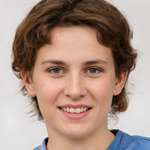 Joyful white young-adult female with medium  brown hair and green eyes