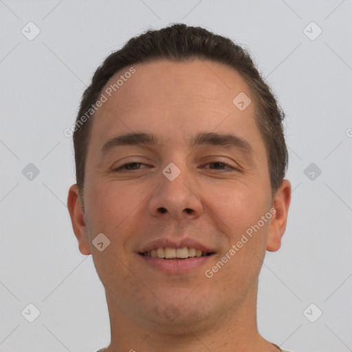 Joyful white young-adult male with short  brown hair and brown eyes