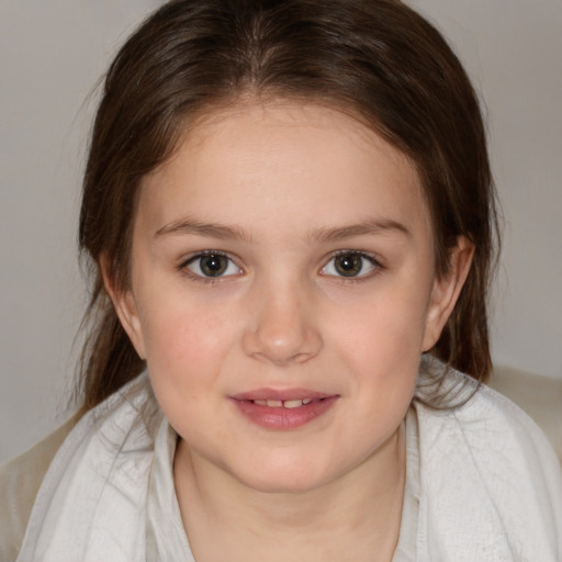 Joyful white child female with medium  brown hair and brown eyes