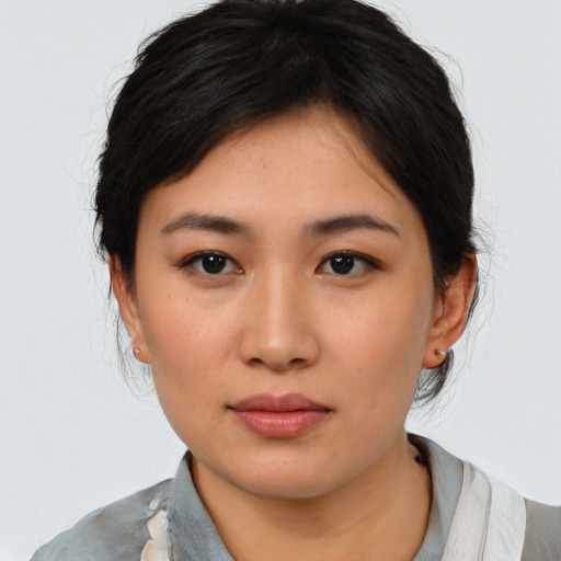 Neutral asian young-adult female with medium  black hair and brown eyes