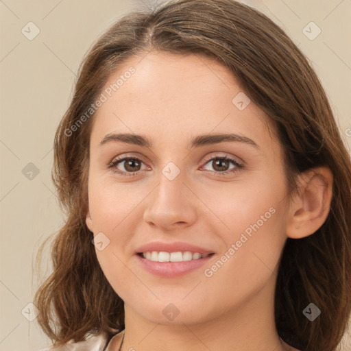 Joyful white young-adult female with long  brown hair and green eyes